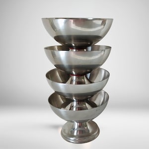 Set of 4 French stainless steel dessert cups, elegant footed design for ice cream, sorbet, or champagne, 1970s/80s retro charm.