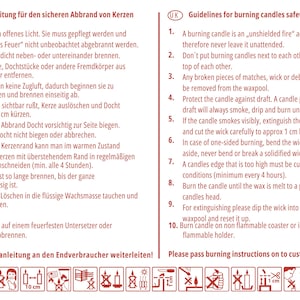 May include: Red and white illustrated safety instructions for burning candles. The instructions are in German and English. The image includes a warning symbol and several icons depicting safe candle use.