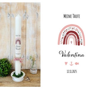 May include: A white baptism candle with a pink and red rainbow design, floral accents, and the text "Meine Taufe", "Luana Rosalie", and "12. September 2023".