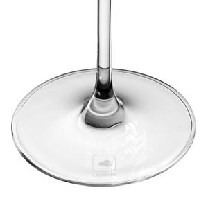 May include: A clear glass stemware base with a circular footprint and a slender vertical stem. The base features a small square logo etched into the glass surface, containing a cloud icon and the word LEONARDO printed in capital letters.