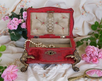 Absolutely spectacular and rare Victorian Napoleon III jewelry / music box in red velvet, beige tufted silk and large brass lion shape feet