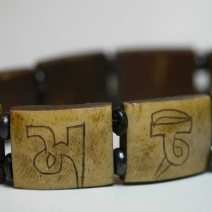 Armband om Ma Ni Pe Me Hung Knochen 77E Bild 2