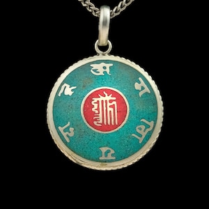 Decorated Buddhist amulet from Nepal, turquoise, silver, red, mandala, Kalachakra