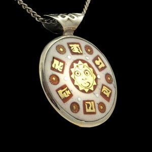 Beautiful Buddhist amulet from Nepal, colorful, round, with OM symbol, sun and mantra, double-sided