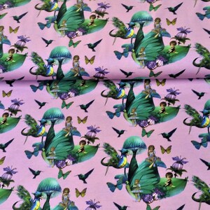 May include: Pink fabric with a repeating pattern of fairies sitting on green mushrooms with butterfly and hummingbird accents.
