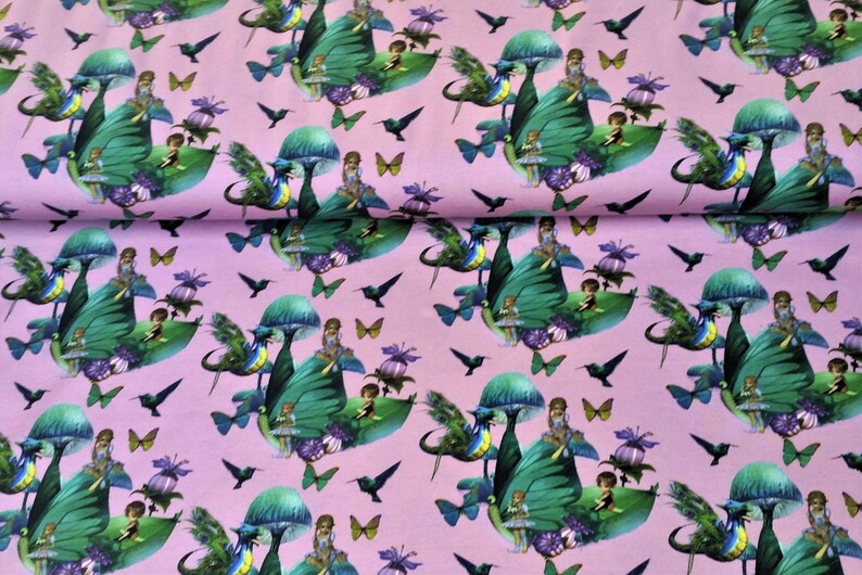 May include: Pink fabric with a repeating pattern of fairies sitting on green mushrooms with butterfly and hummingbird accents.