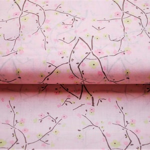 May include: Pink fabric with a repeating pattern of brown branches and pink and green flowers.