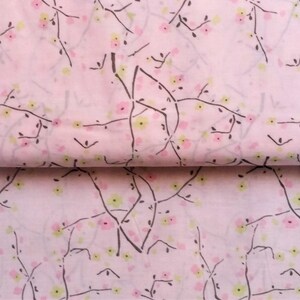 May include: Pink fabric with a repeating pattern of black branches and small pink and yellow flowers.