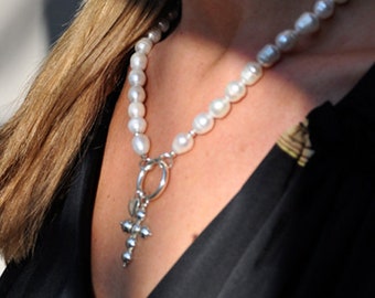 silver cross with white pearl necklace