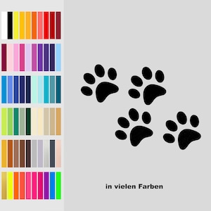Könnte beinhalten: Vier schwarze Pfotenabdrücke in einer Reihe, mit dem Text "in vielen Farben" darunter.