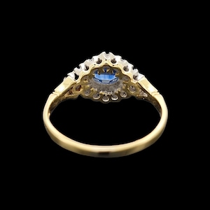 Vintage 18ct Yellow & White Gold Sapphire and Diamond Cluster Ring rear view, on a black background