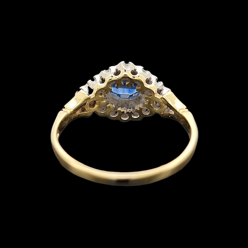 Vintage 18ct Yellow & White Gold Sapphire and Diamond Cluster Ring rear view, on a black background