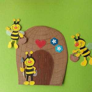 Ruche en carton avec photo de fenêtre