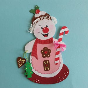 Bonhomme de neige en carton avec image de fenêtre en glaçage