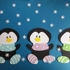 Raamafbeelding van drie pinguïns op karton