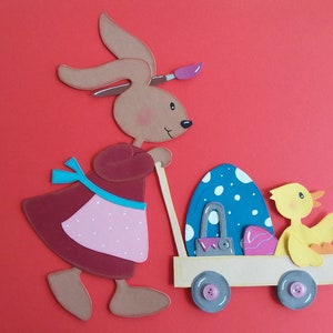 Fensterbild Tonkarton Hase Ostern Mädchen mit Osterwagen