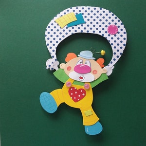 Image de fenêtre en carton clown volant