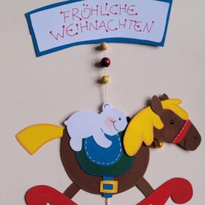 Plaque de porte Cheval de Noël cheval à bascule