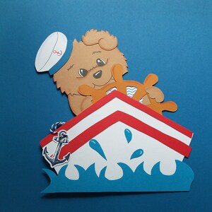 Imagem de janela de papelão urso barco marítimo