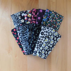 May include: A set of three ceramic mugs with a speckled, matte finish. The mugs are in shades of cream, light gray, and dark gray. Each mug has a simple, minimalist design, perfect for coffee or tea.