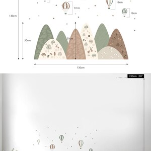 May include: XL wall decal featuring a mountain range and hot air balloons in shades of green, brown, and beige. The mountain range is 51 inches wide and 19.5 inches high. The hot air balloons are between 4 and 7.5 inches wide.