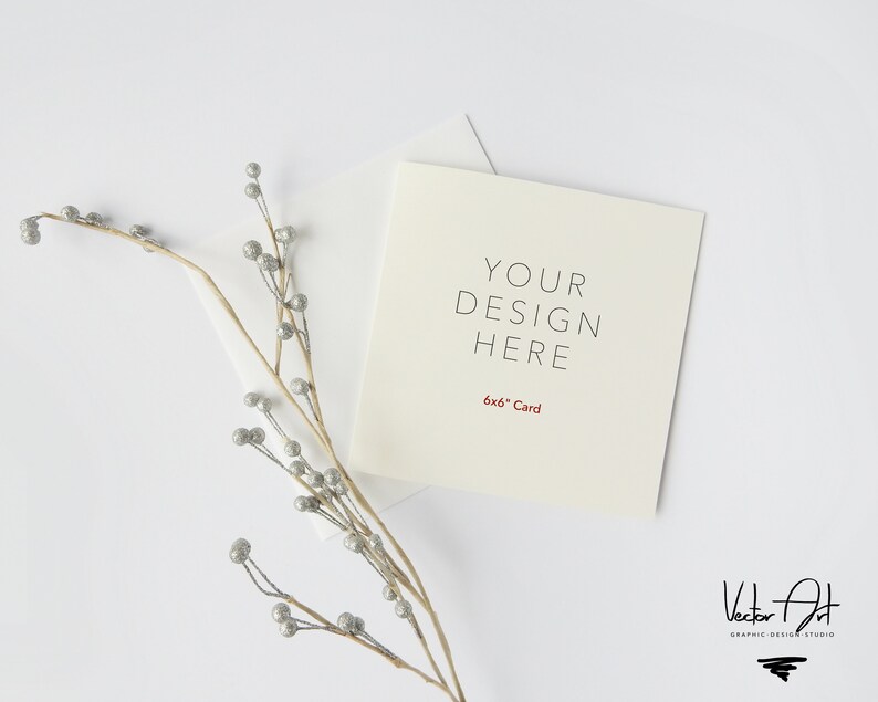 May include: A white card with the text "YOUR DESIGN HERE" and "6x6" Card printed in red. The card is on a white surface with a sprig of silver berries.