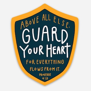 May include: A yellow and blue shield-shaped sticker with the text "ABOVE ALL ELSE, GUARD YOUR HEART FOR EVERYTHING FLOWS FROM IT. PROVERBS 4:23".