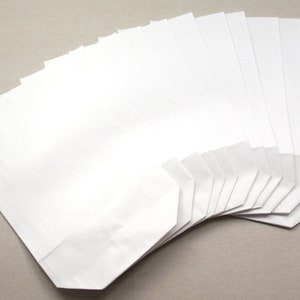 Sacchetti di carta formato bianco. L con borsa inferiore per sacchetti regalo