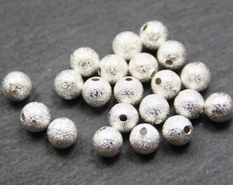 10 x perles métalliques Stardust 8 mm argent