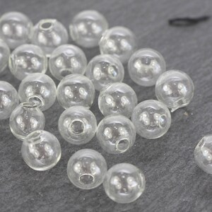 12 x perline cave 10 mm 1 foro perla di vetro trasparente NUOVO immagine 2