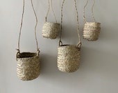 Cache pot suspended in straw