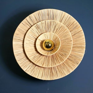 Round raffia wall light