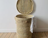 Round storage basket in palm leaves