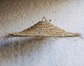 Doum suspension in braided straw parasol shape