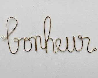 Mot en laiton doré - Bonheur