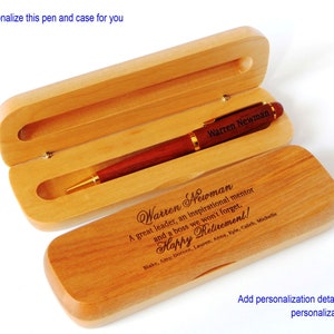 May include: A wooden pen and case set with a personalized inscription. The inscription reads "Warren Newman A great leader, an inspirational mentor and a boss we won't forget. Happy Retirement! Blake, Amy, Doreen, Lauren, Anna, Kyle, Caleb, Michelle".