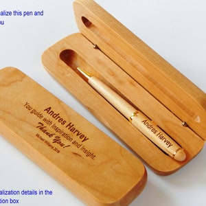 May include: A light-colored wooden pen and case set. The pen is inside the open case, with the name "Andres Harvey" engraved on both the pen and the case. The case also has the text "You guide with Inspiration and Insight. Thank You!" and "Michael Williams 2019".