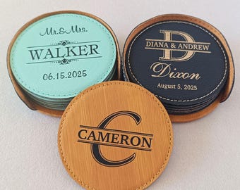 May include: Three sets of round, personalized coasters in mint green, black, and tan faux leather. The mint coaster reads Mr. & Mrs. WALKER 06.15.2025. The black coaster reads DIANA & ANDREW Dixon August 5, 2025. The tan coaster features a large letter C and CAMERON.