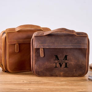 Neceser de viaje de cuero personalizado unisex, organizador portátil colgante para champú de viaje, juego de brochas y accesorios de maquillaje