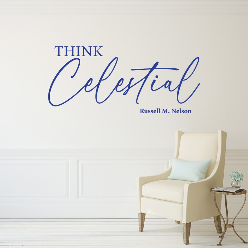 Blue vinyl decal with the text "Think Celestial Russel M. Nelson" quote. Set on the wall of a clean living room.