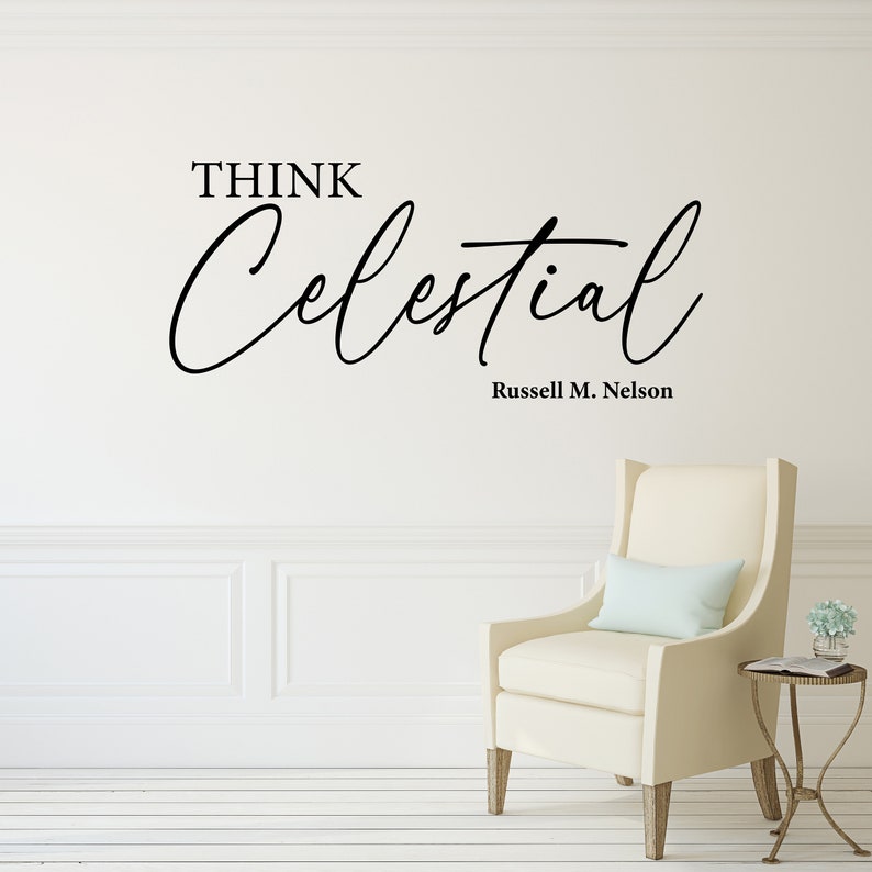 Black vinyl decal with the text "Think Celestial Russel M. Nelson" quote. Set on the wall of a clean living room.