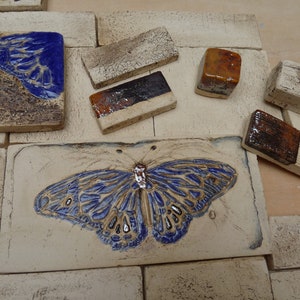 grounded, sand-colored tiles butterfly wall tiles ceramic tiles fireplace decoration