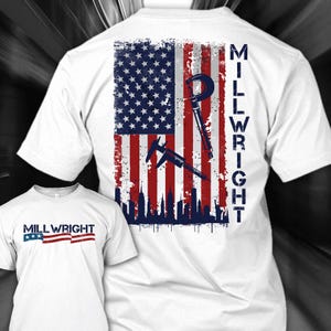 May include: White t-shirt with an American flag design, tools, and the text "MILLWRIGHT". The design includes a city skyline silhouette. A smaller version of the shirt is also visible in the image.