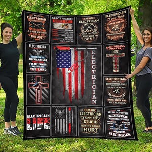 May include: A black blanket featuring various electrician-themed graphics and text. The design includes an American flag with tools, a cross, and phrases like "Electrician's Prayer" and "I'm an Electrician." The blanket is held by two women.