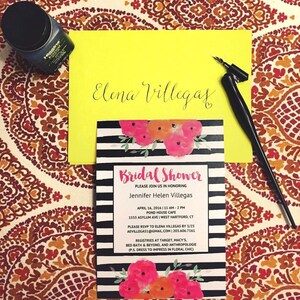 May include: A black and white striped bridal shower invitation with pink and orange floral accents. The invitation includes the bride's name, Jennifer Helen Villegas, the date and time of the shower, the location, and RSVP information. The text "Bridal Shower" is written in a bold, cursive font.
