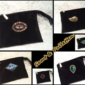 May include: Five black velvet pouches with different sequin designs. The pouches have a zipper closure and a small strap. The text "Samt & Pailetten" is visible in the image.