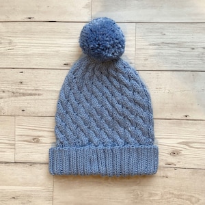 Gorro de invierno con pompón de Jaime Cable para niñas y niños