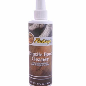 May include: A white bottle with a spray nozzle labelled "Fiebing's Reptile Boot Cleaner". The bottle is 8 fluid ounces and contains 236 millilitres. The label also states that the cleaner cleans, polishes, and preserves genuine and imitation reptile leathers.