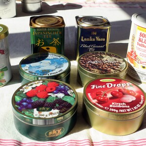 Vintage lovable sheet metal cans with colorful product print