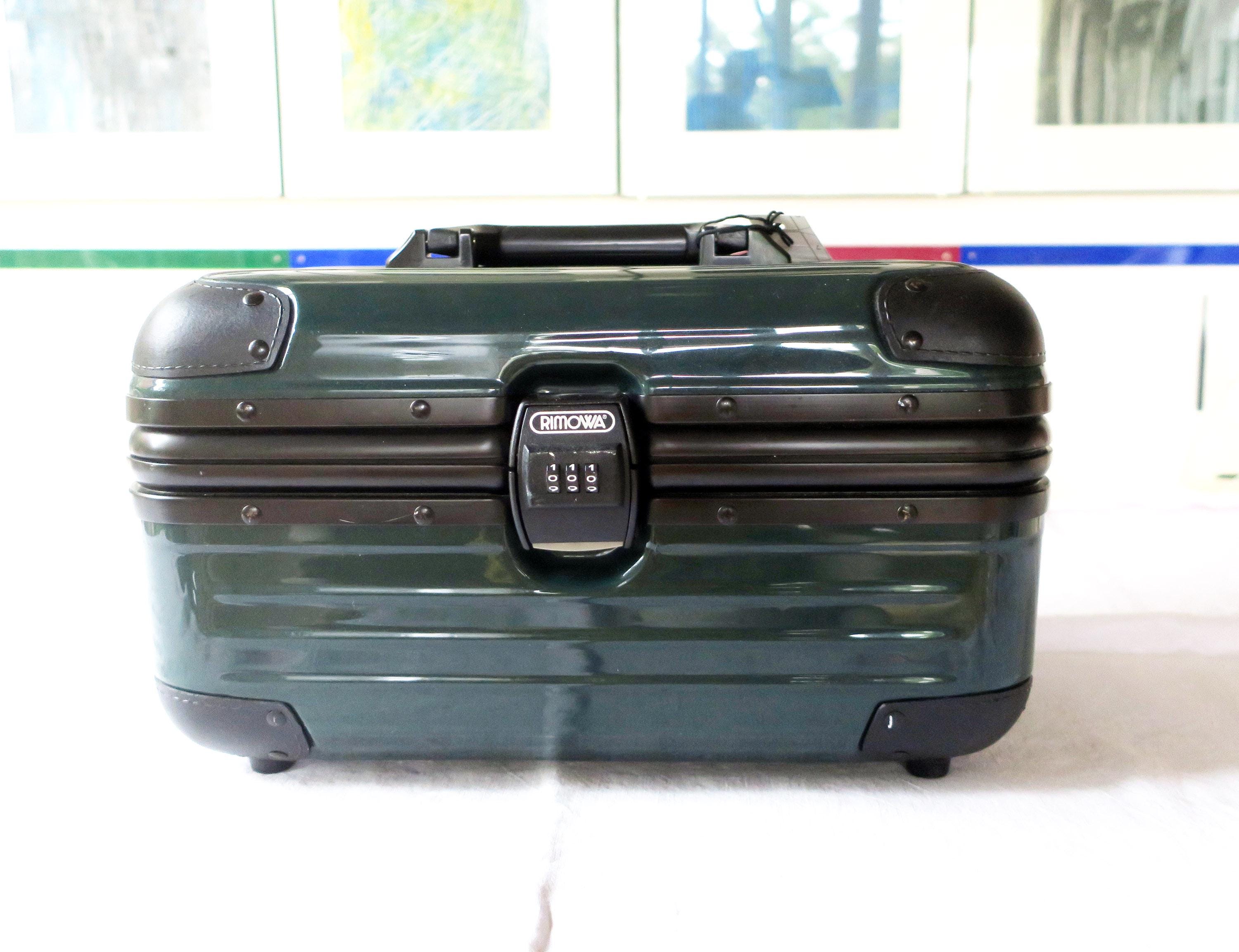 Vintage cosmetic case travel case make-up case Rimova made of polycarbonate in green with combination lock
